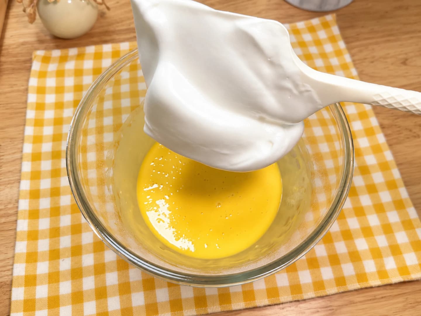 Whip the egg whites and combine the batter